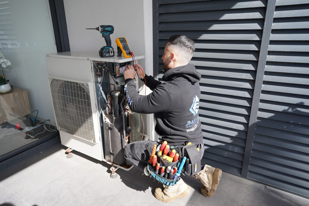 Expert Daikin ducted air conditioning repairs by Jmax Air — restoring comfort, efficiency, and performance to your home or business. Daikin ducted air conditioning unit undergoing professional repair by certified technician