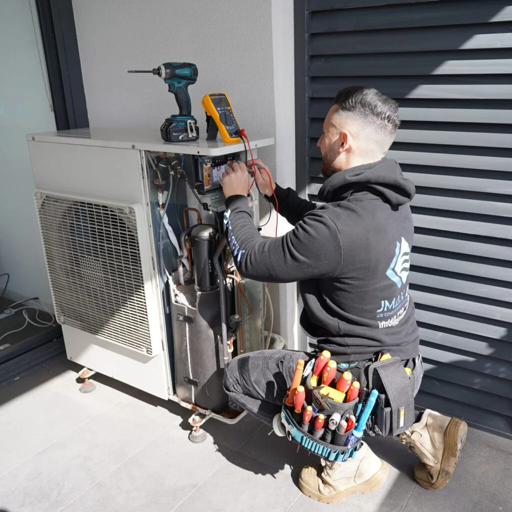 Expert Daikin ducted air conditioning repairs by Jmax Air — restoring comfort, efficiency, and performance to your home or business. Daikin ducted air conditioning unit undergoing professional repair by certified technician